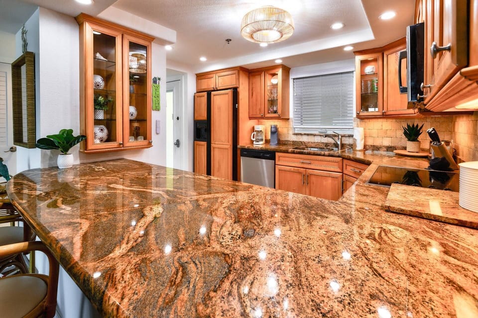 The updated kitchen is designed to inspire your inner chef with modern appliances and plenty of space to create delicious meals.