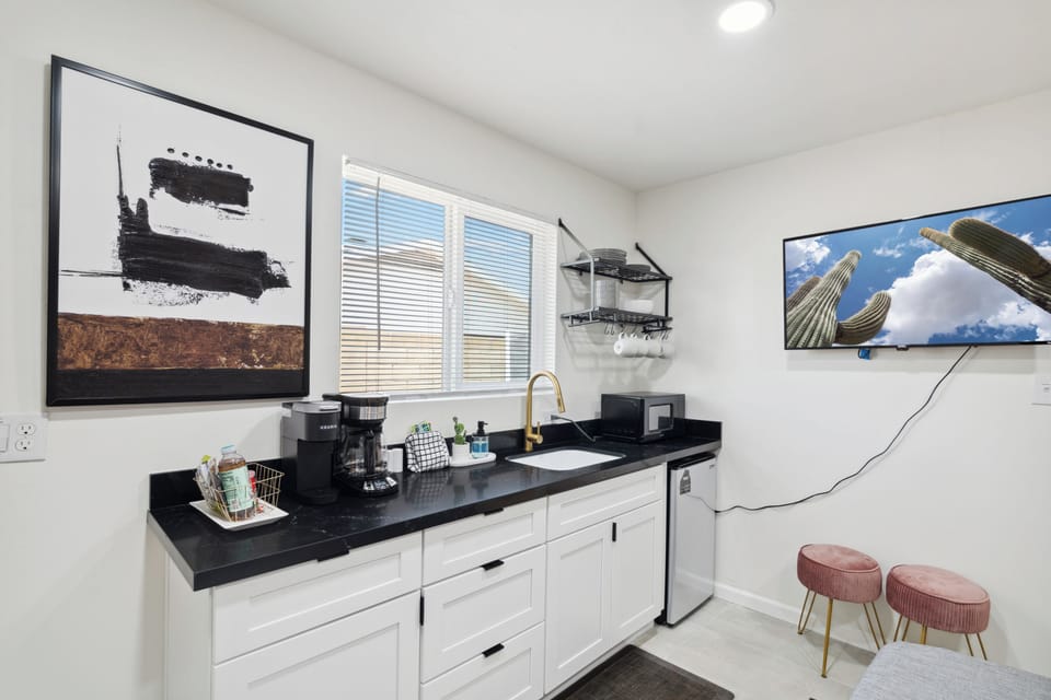 This mini kitchen resides within the second primary bedroom and includes everything you'll need for basic meals.