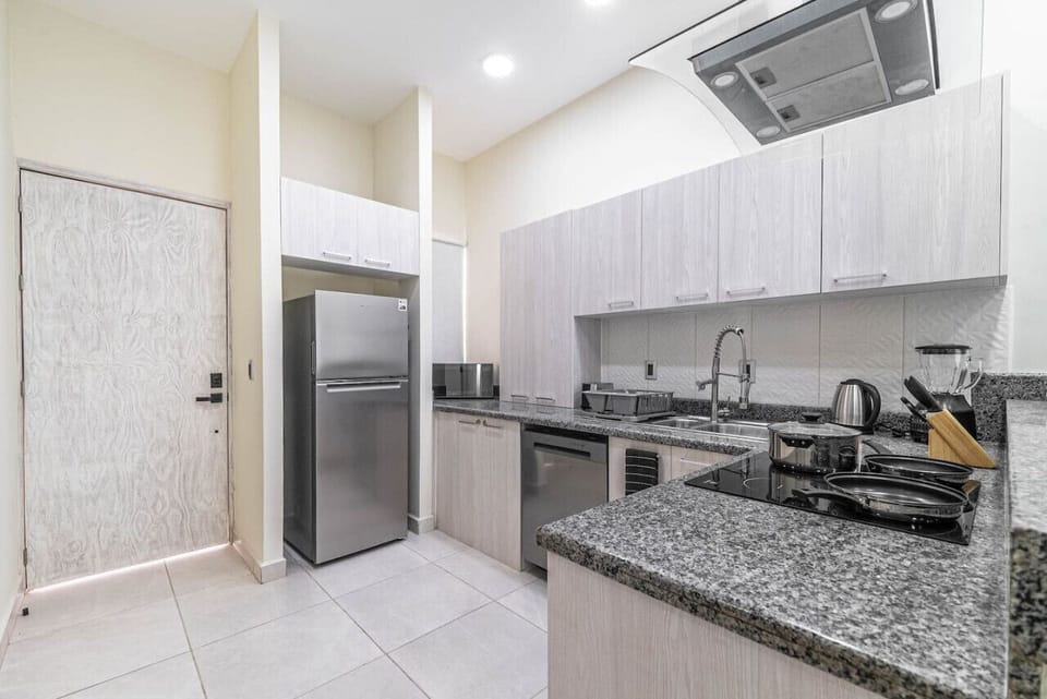 Gather around the kitchen island in this stylish space, where cooking and conversation blend seamlessly