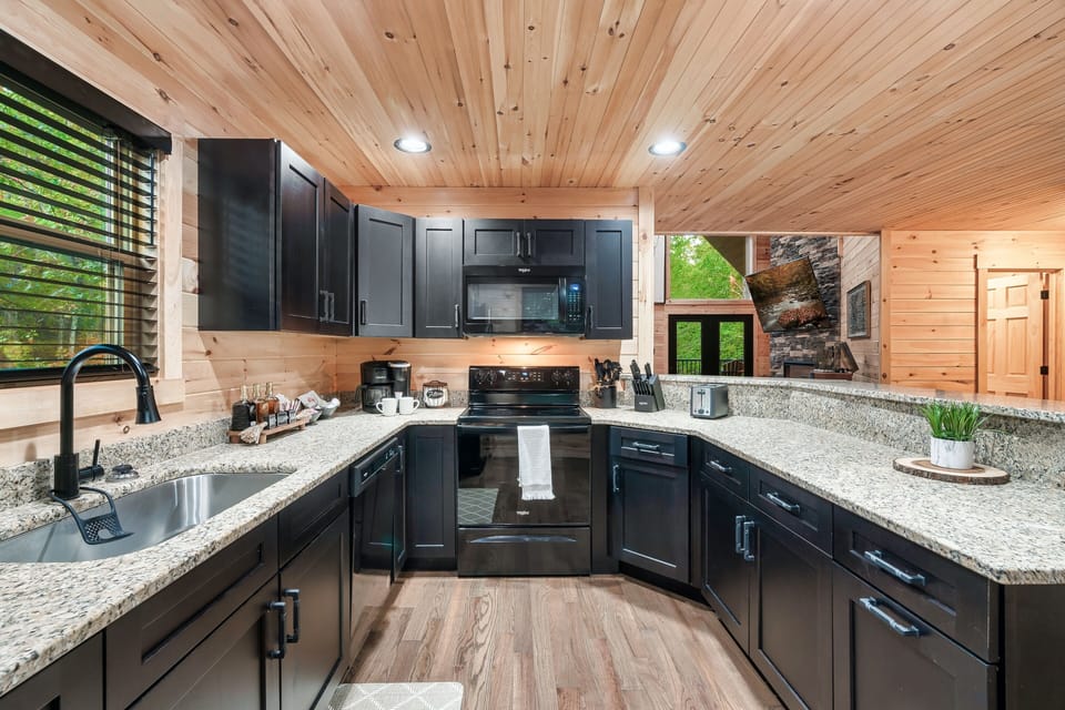 Abundant cabinet space, an oversized sink, and cleverly hidden trash containers.
