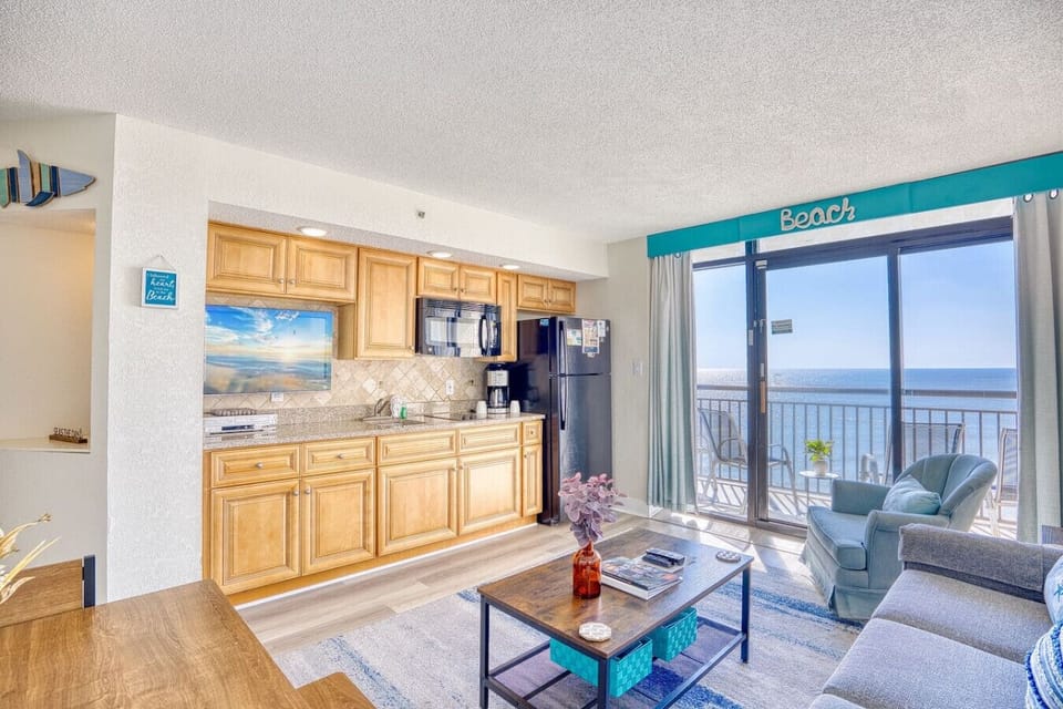 This beachfront living room, is ideal for relaxation after exploring North Myrtle Beach. Enjoy oceanfront views from the comfy sofa, or step out on a balcony overlooking the pool and watch the moonlight on the waves. Includes a queen-sized sofa bed.