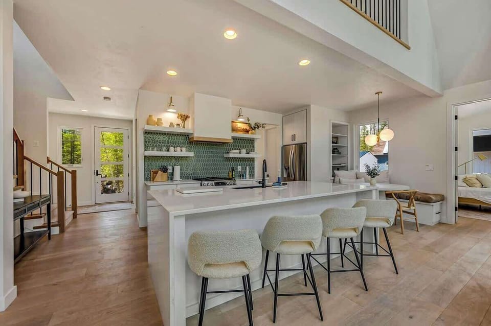 The fully equipped kitchen is a chef’s dream, featuring modern appliances and plenty of counter space for preparing meals
