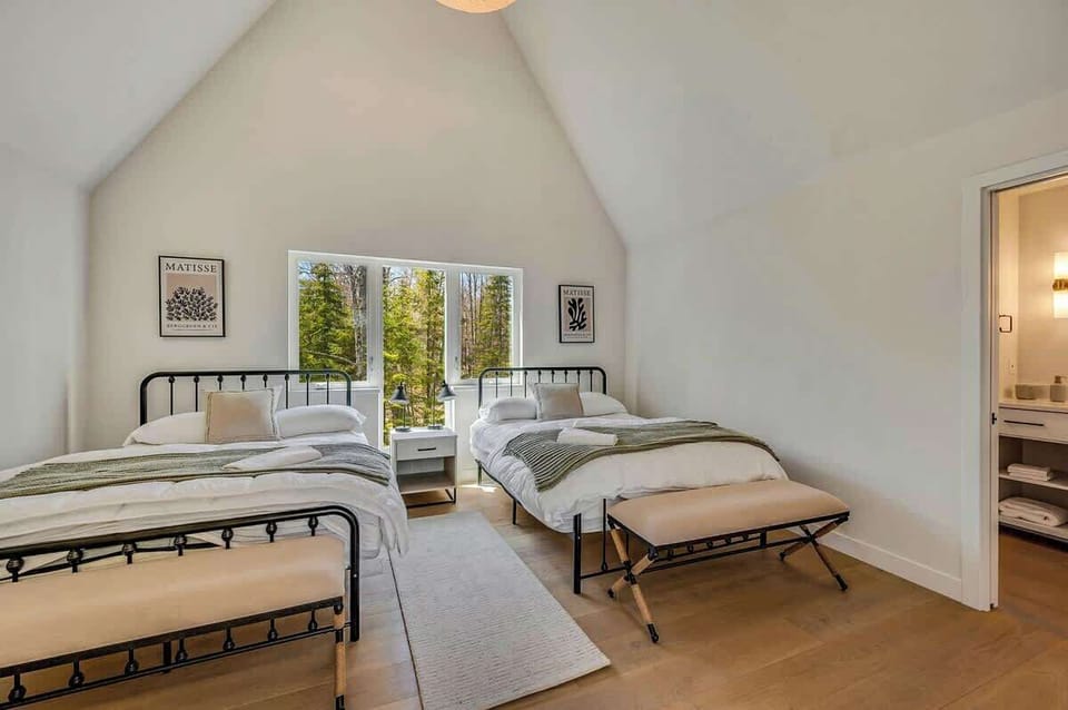 It also features a bedroom with two queen beds, a full bathroom, and generous closet space for added convenience. 