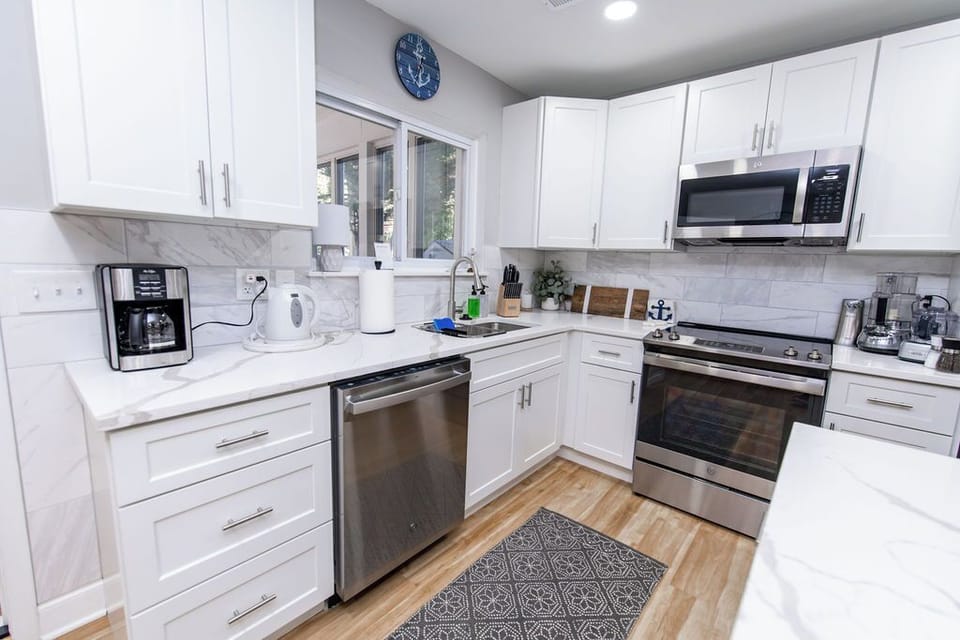 Recently renovated kitchen with quartz countertops, stainless steel appliances, and all the gadgets, tools, and amenities you need to cook wonderful meals.