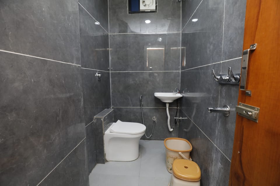 Standard Triple Room, City View | Bathroom | Shower, hair dryer (on request), slippers, towels