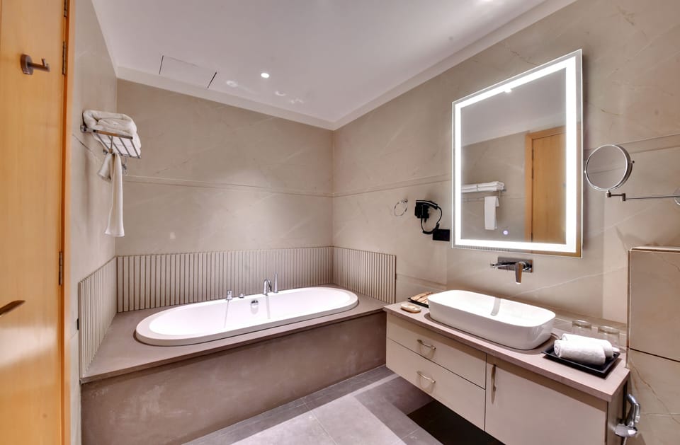Shower, slippers, bidet, towels