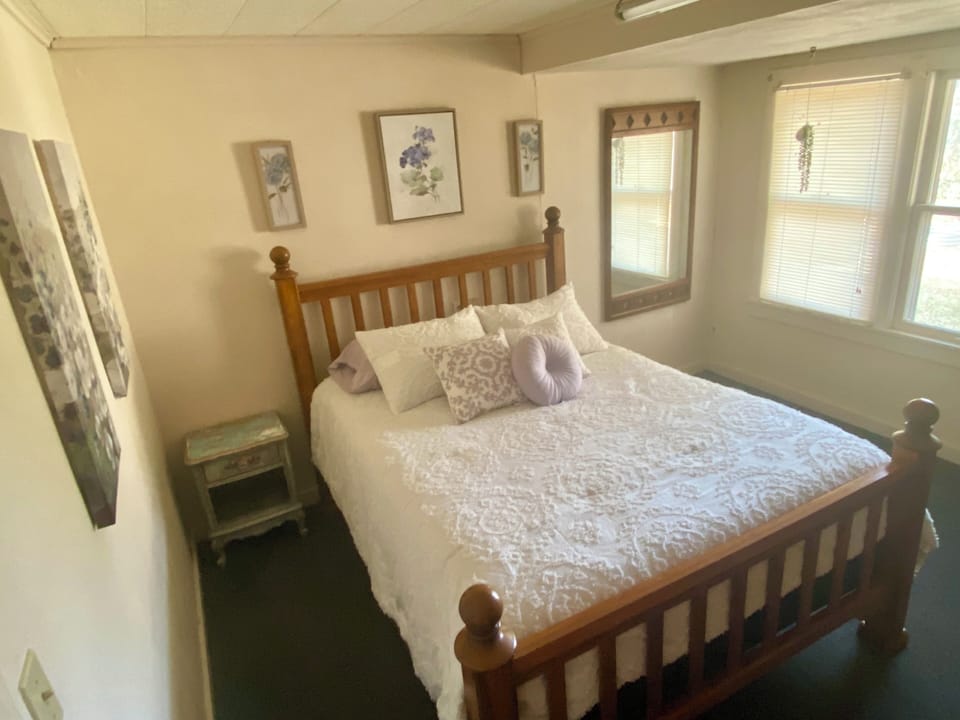 Bedroom 2 has a large closet, great lighting & a door to small porch outside. 