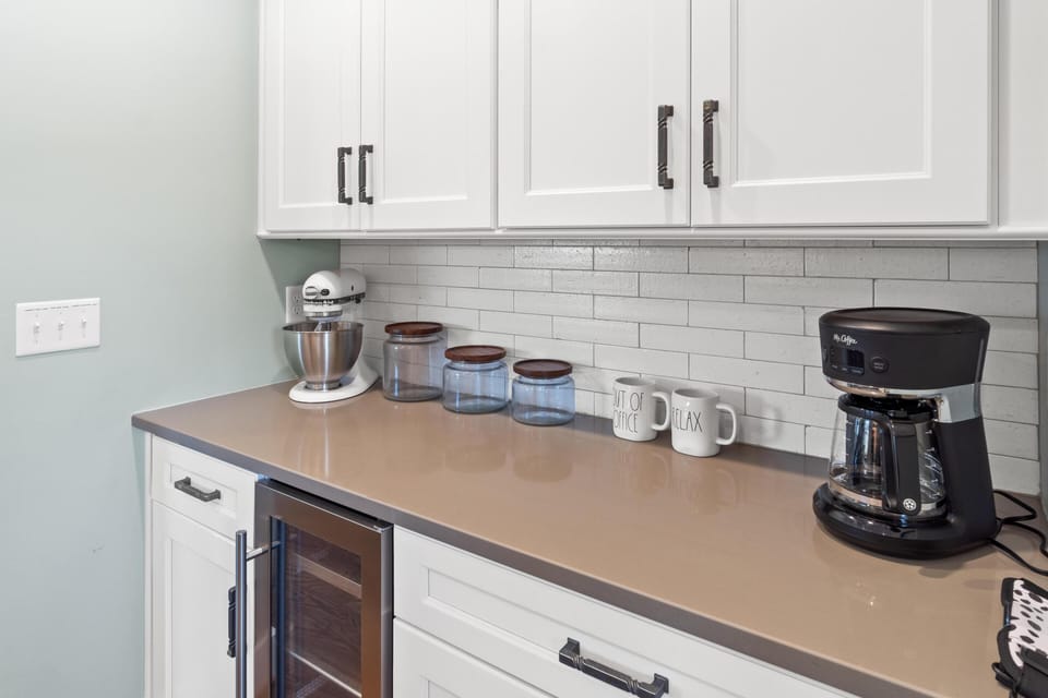 A dedicated beverage fridge keeps cold drinks on hand
