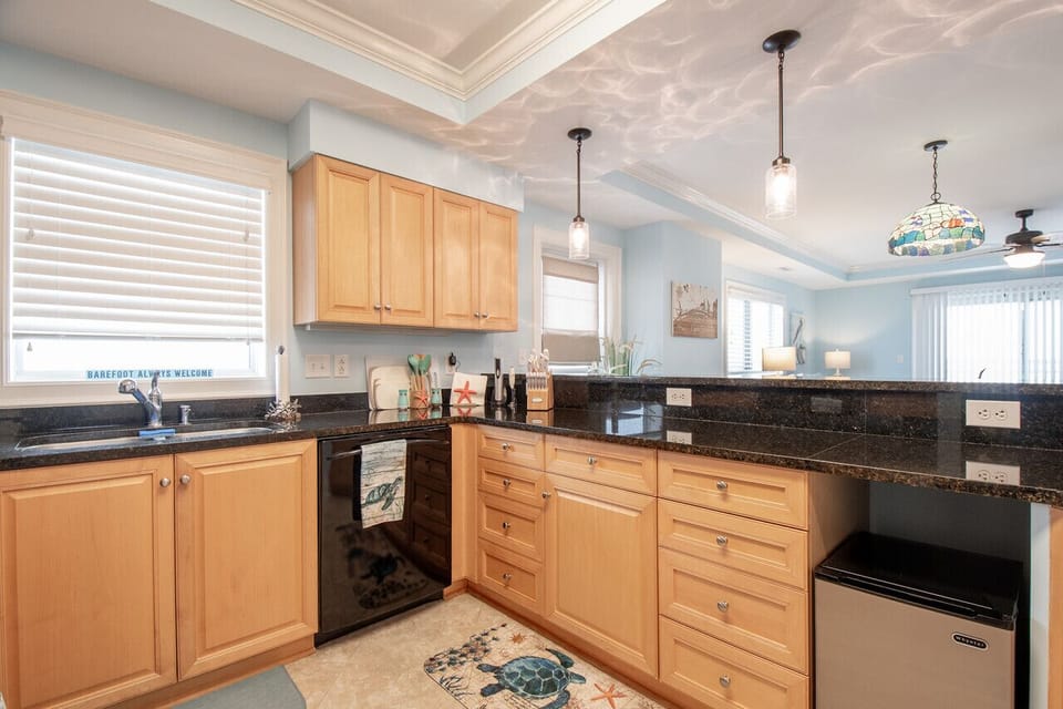 Well-equipped kitchen with granite countertops and open-concept design