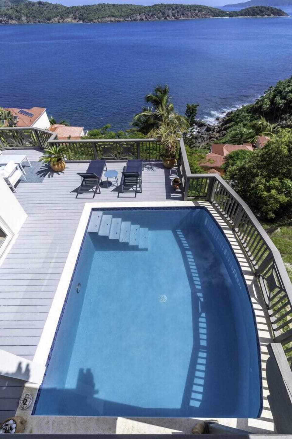 A view of the pool and ocean from bedroom 1`s private balcony.