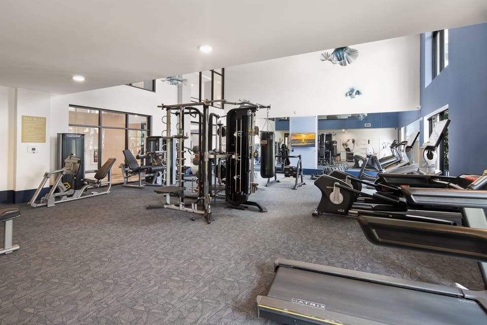 A community gym is a dedicated space in your home designed for fitness and exercise. It typically includes a selection of equipment tailored to your workout preferences and goals