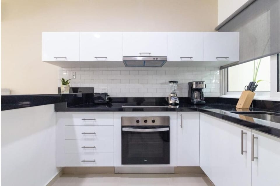 Full-size fridge, toaster, blender, cookware/dishes/utensils