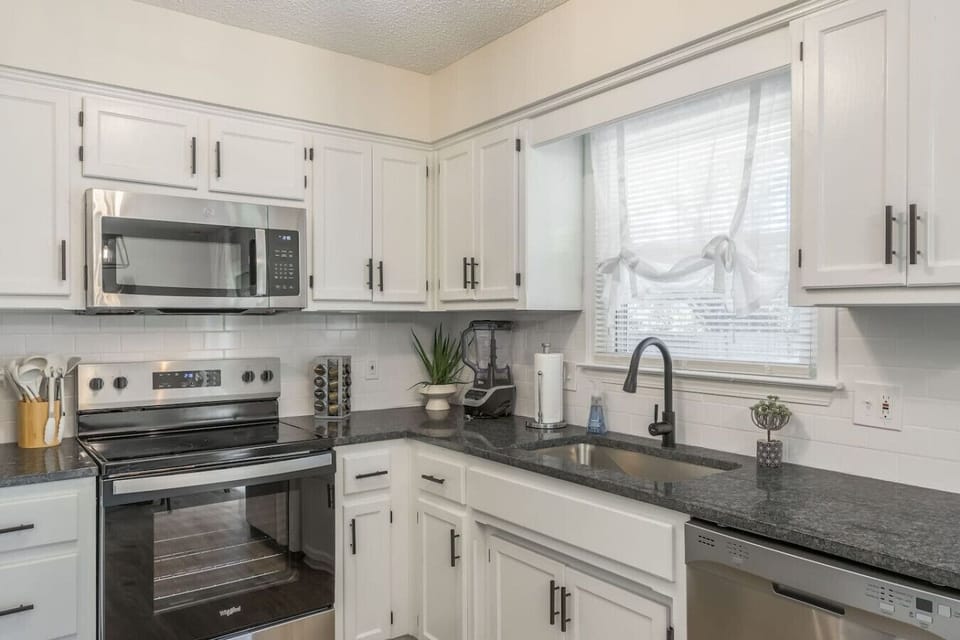 A stylish, fully equipped kitchen with modern appliances and ample counter space, perfect for cooking meals or enjoying a quick breakfast. Thoughtfully designed for convenience and comfort.