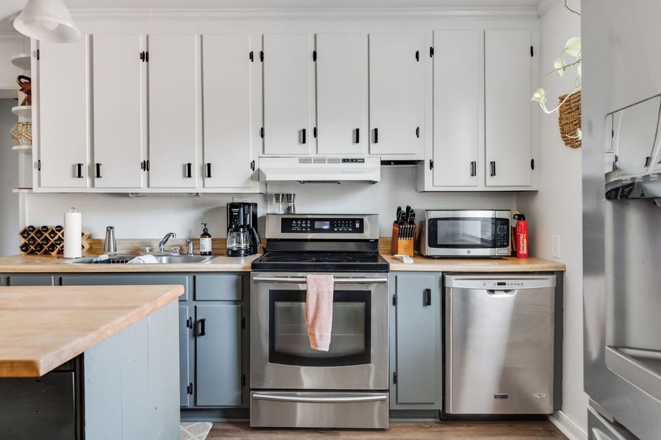 Kitchen: Whip up culinary delights in this modern space with stylish finishes and ample prep room!