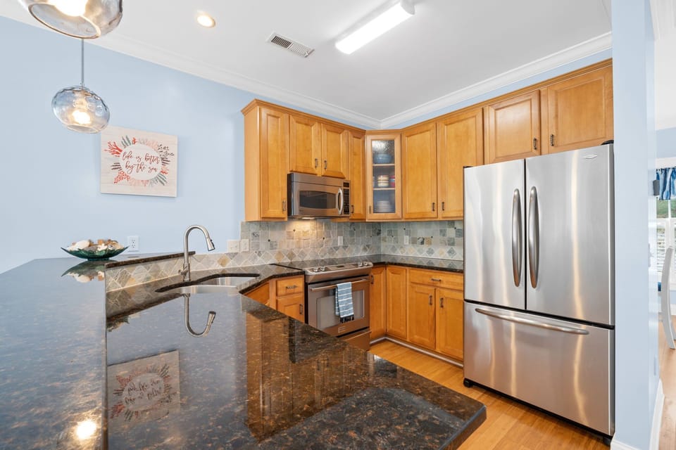 Kitchen with large bar area for sitting and serving 