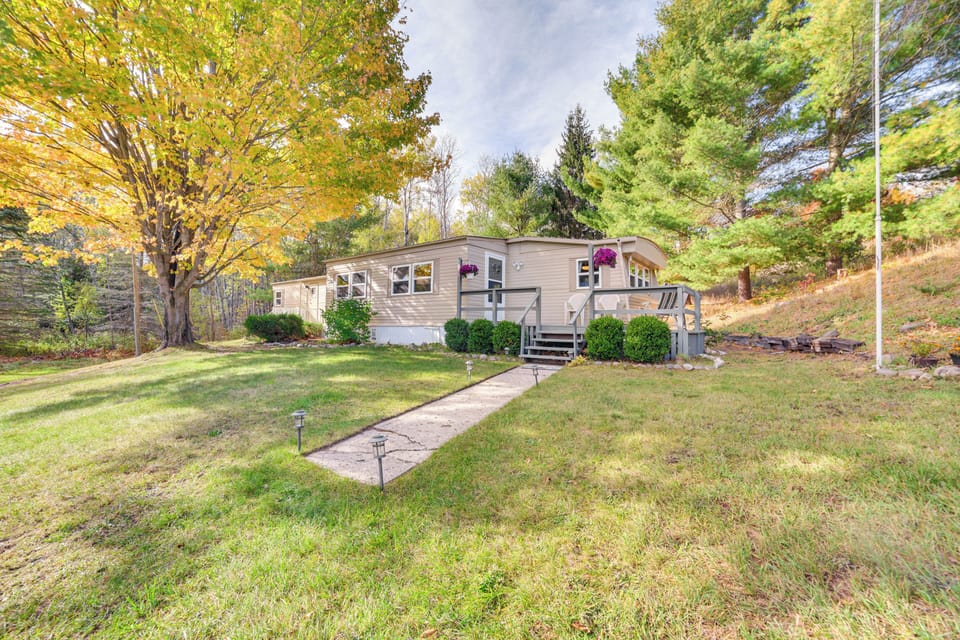 Property Exterior | Spacious Yard | Wooded Surroundings