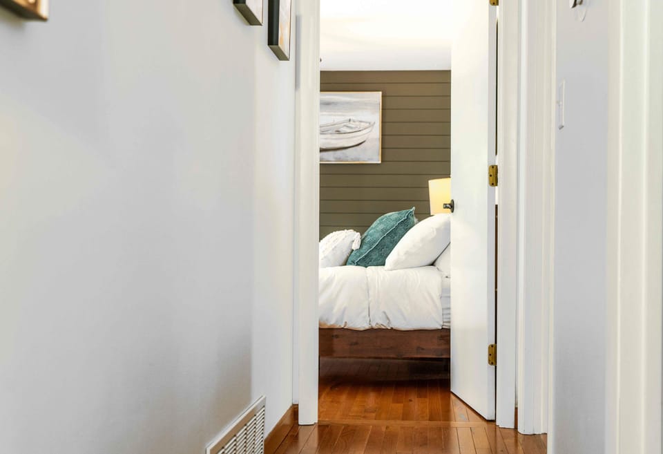 The second bedroom retreat boasts a pair of cozy full-sized beds