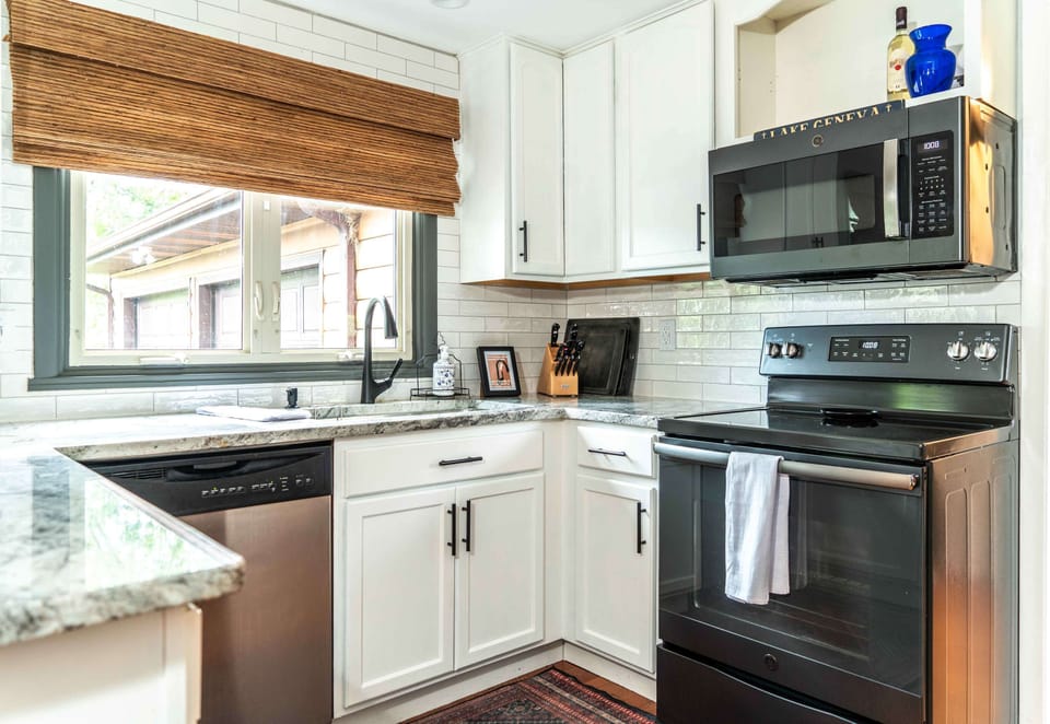 The airy, open kitchen offers ample space & all the comforts of home