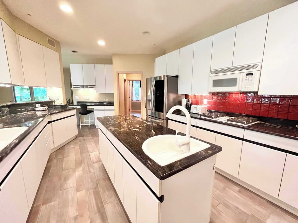 The grand kitchen offers loads of space & all the comforts of home