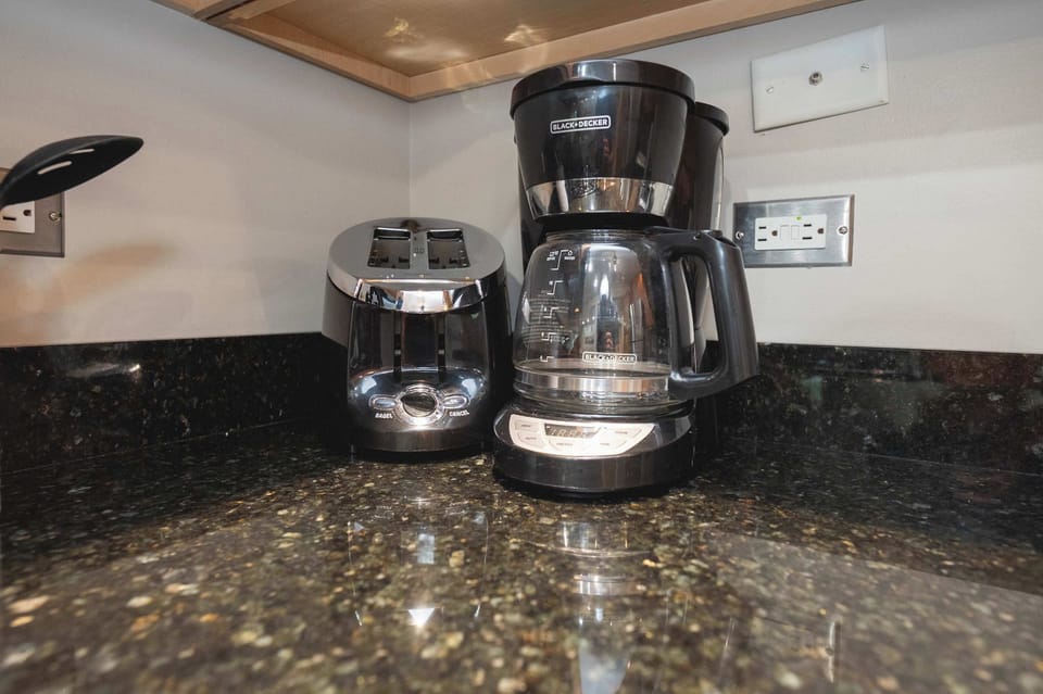 The kitchen offers ample storage space & all the comforts of home