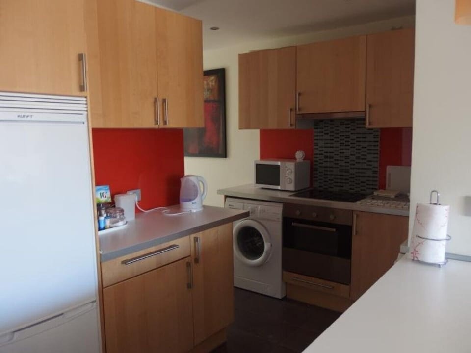 Kitchen with Washing Machine,
 and Microwave 