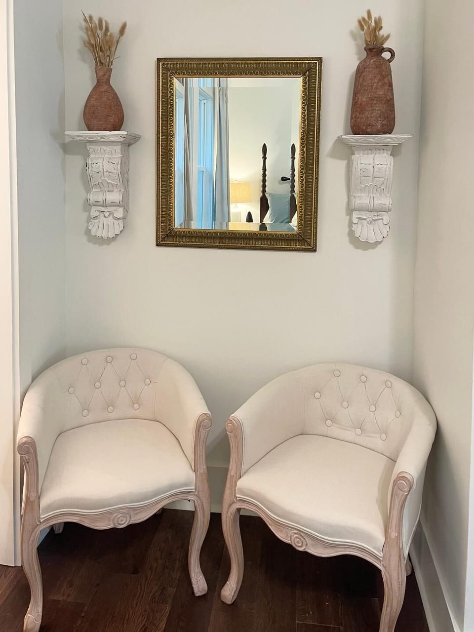 King bedroom nook with mirror space for getting ready, seating for lounging, etc