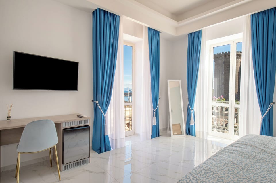 Exclusive Suite, Balcony, Sea View | Minibar, in-room safe, laptop workspace, blackout drapes