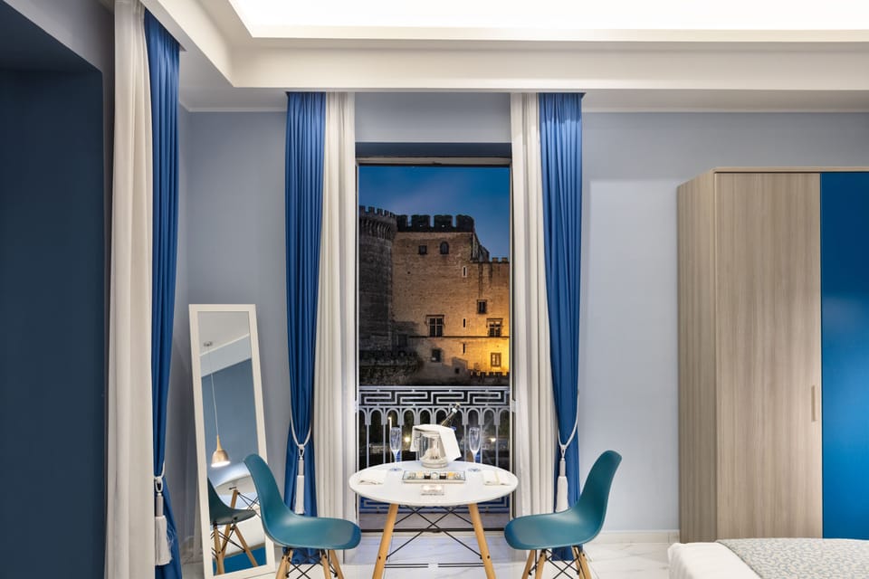 Exclusive Suite, Balcony, Sea View | Minibar, in-room safe, laptop workspace, blackout drapes