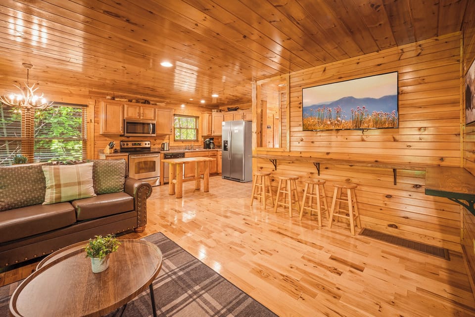 Comfortable living area and kitchen with large dining table and bar seating