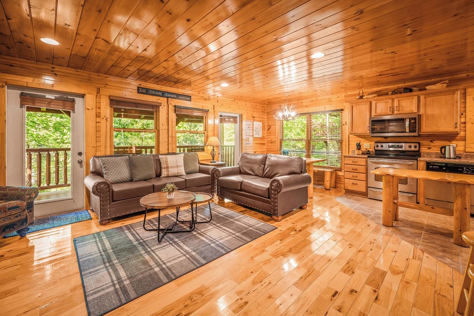 Main living area opens to the upper back deck with rockers and a swing seat.