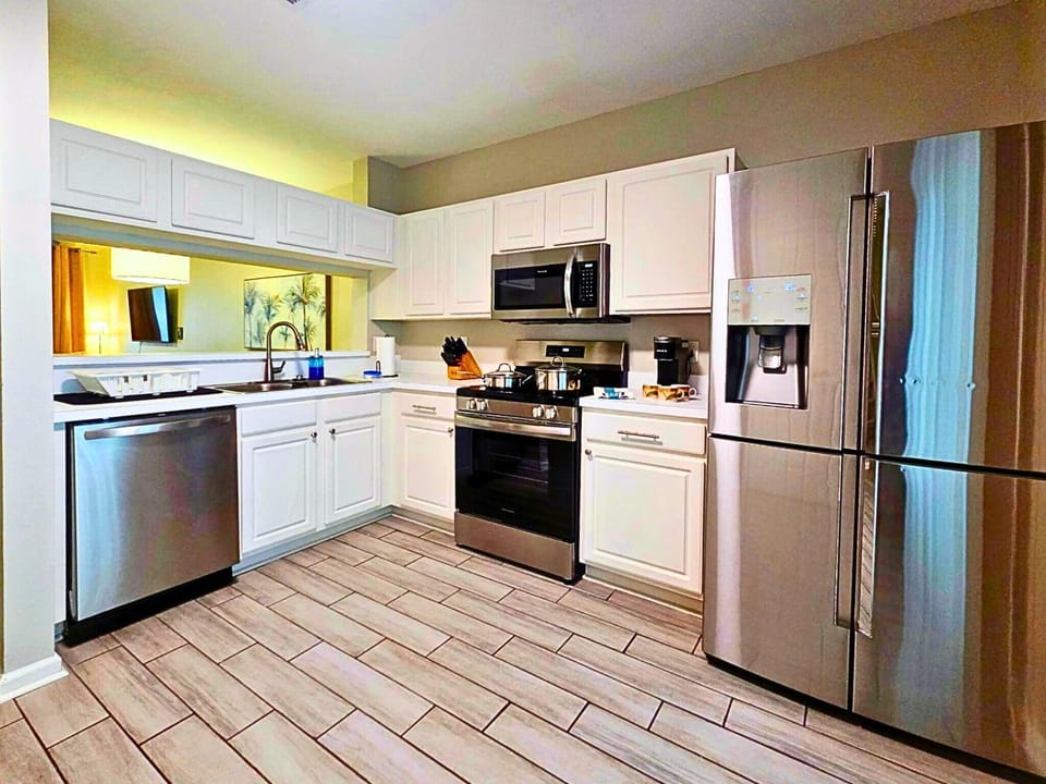 Fully stocked kitchen with modern appliances and ample storage