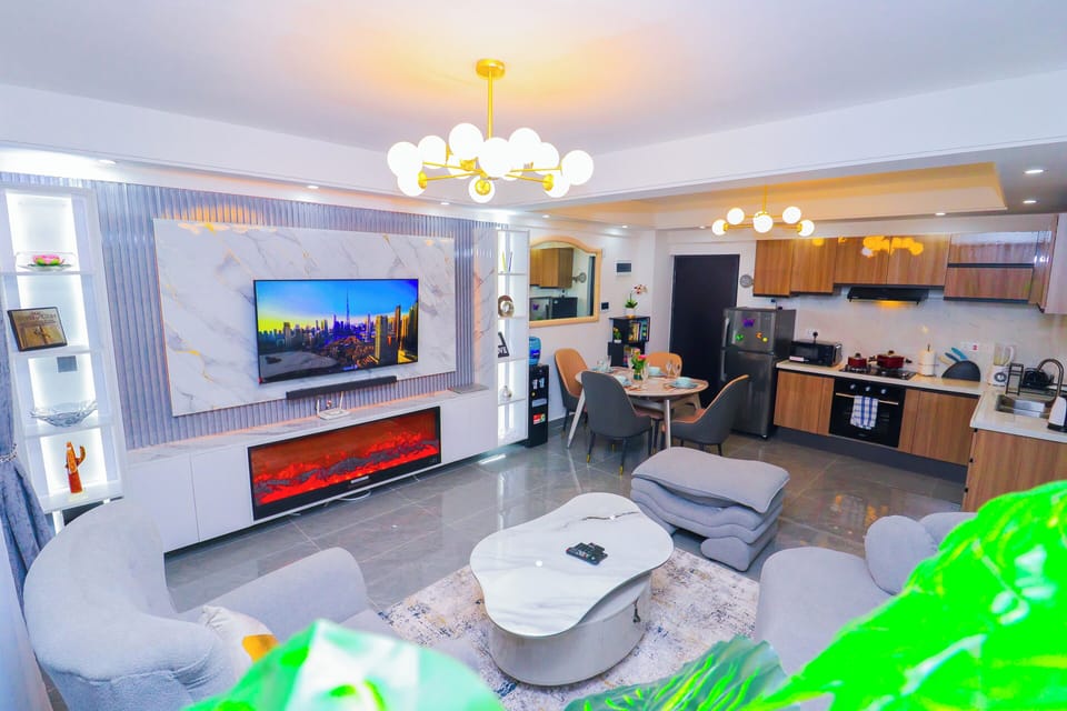 Apartment | Living area | TV, fireplace