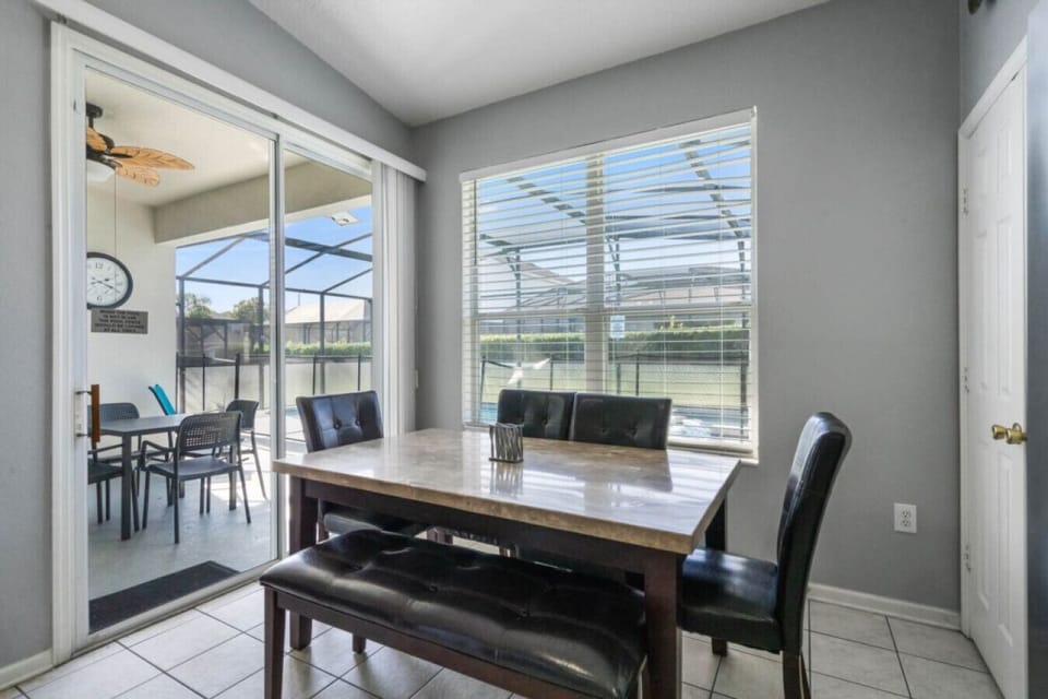 Dine with your family in our dining area with the view of the pool.