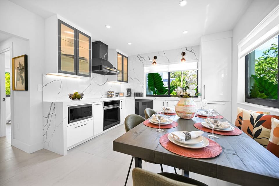 "Bright living area with bold orange chairs and modern accents."