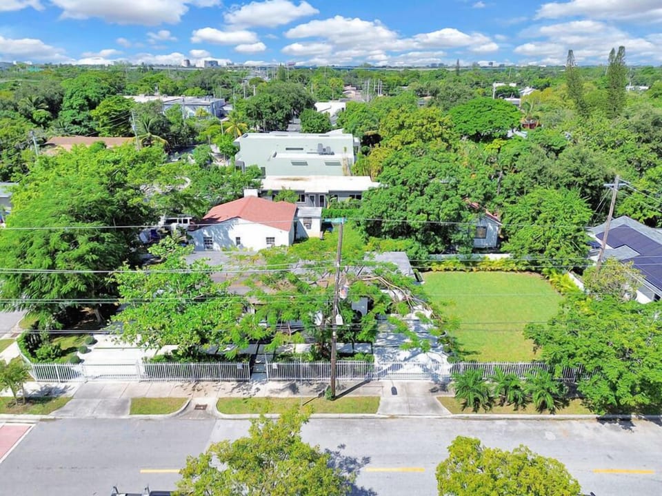 "Stylish modern home with a lush garden and spacious driveway."