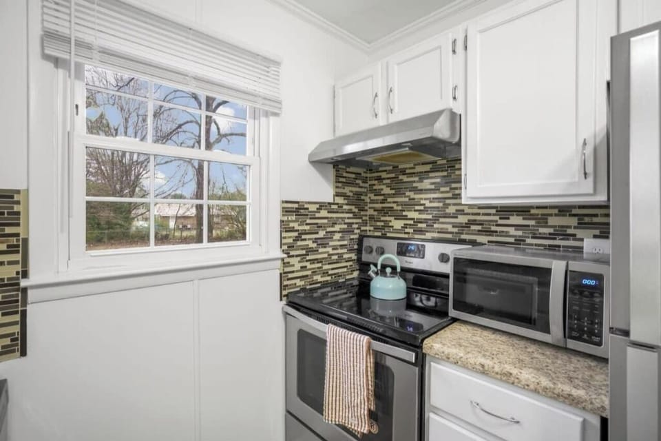 There's an ample counter space, modern appliances, and bright window.
