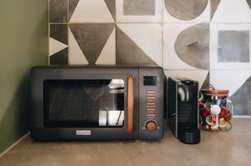 Modern and sleek, this kitchen setup offers everything you need in a compact and stylish space, ideal for simple, relaxed living.