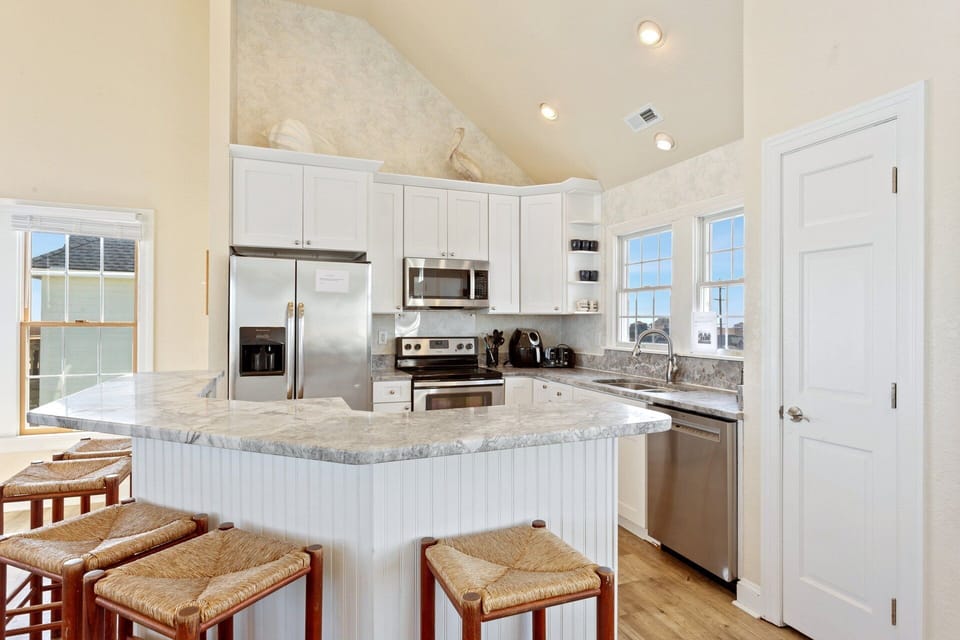 The Kitchen with granite countertops and a convenient breakfast island offer the ideal space to prepare delicious meals that the whole family will enjoy.