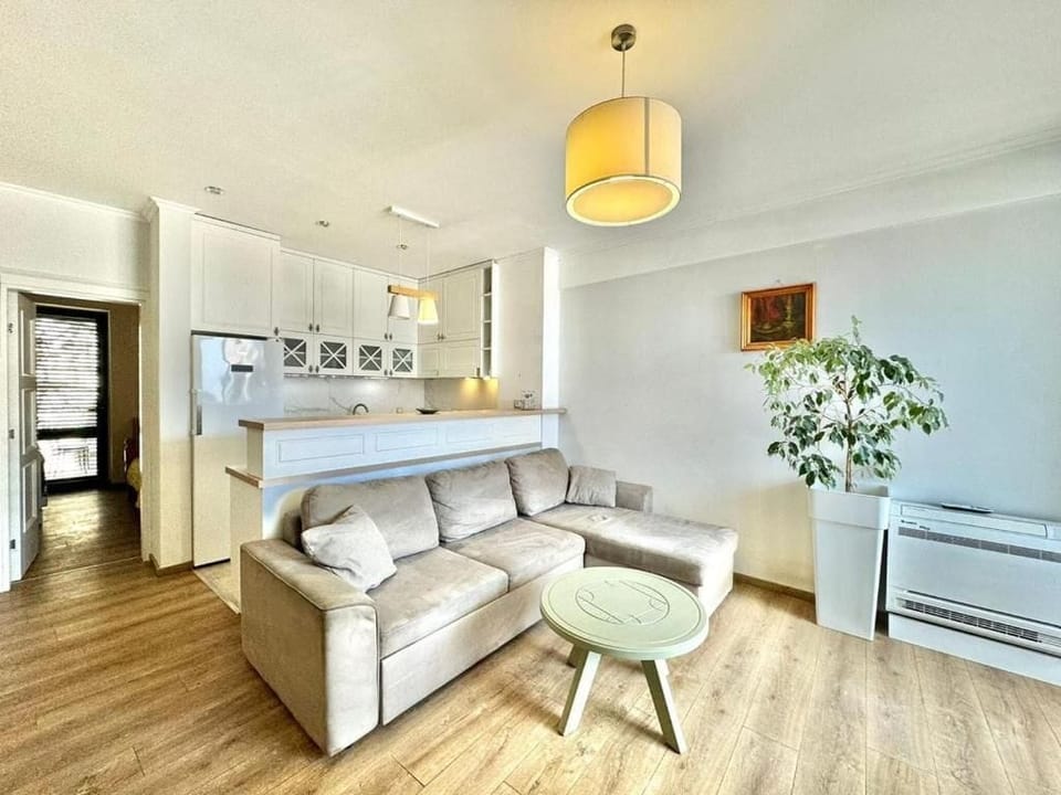 Standard Apartment | Living area | 42-inch flat-screen TV with digital channels