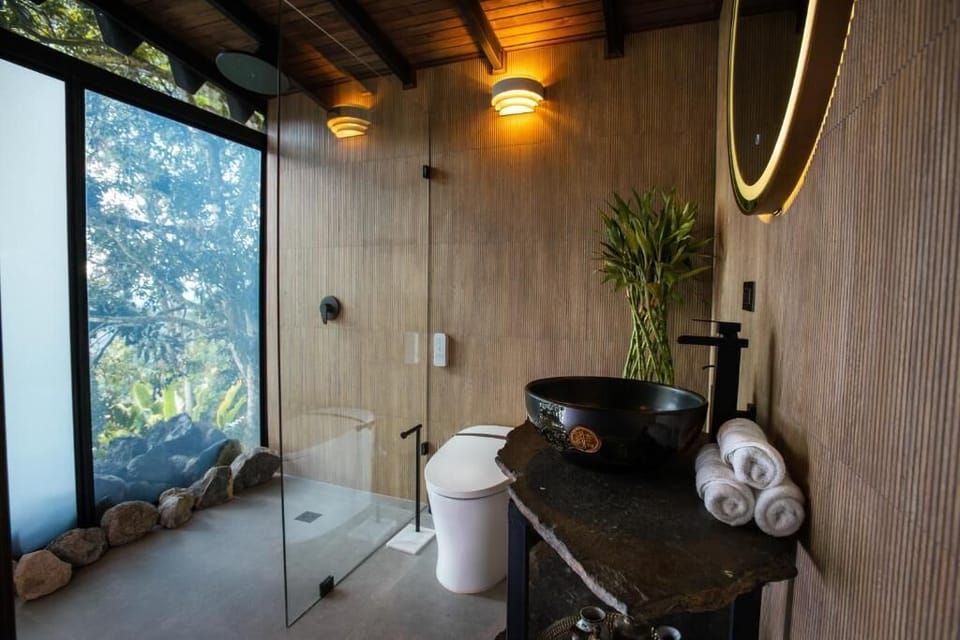 Family Suite, Multiple Beds | Bathroom | Shower, rainfall showerhead, eco-friendly toiletries, towels