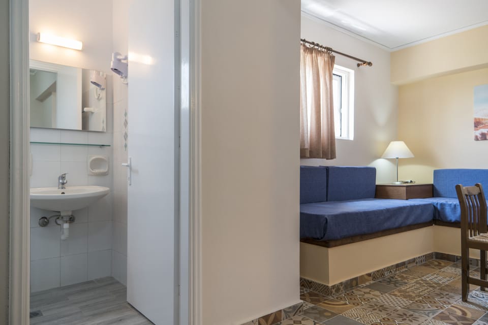 Family Apartment, Sea View | Living area | Flat-screen TV