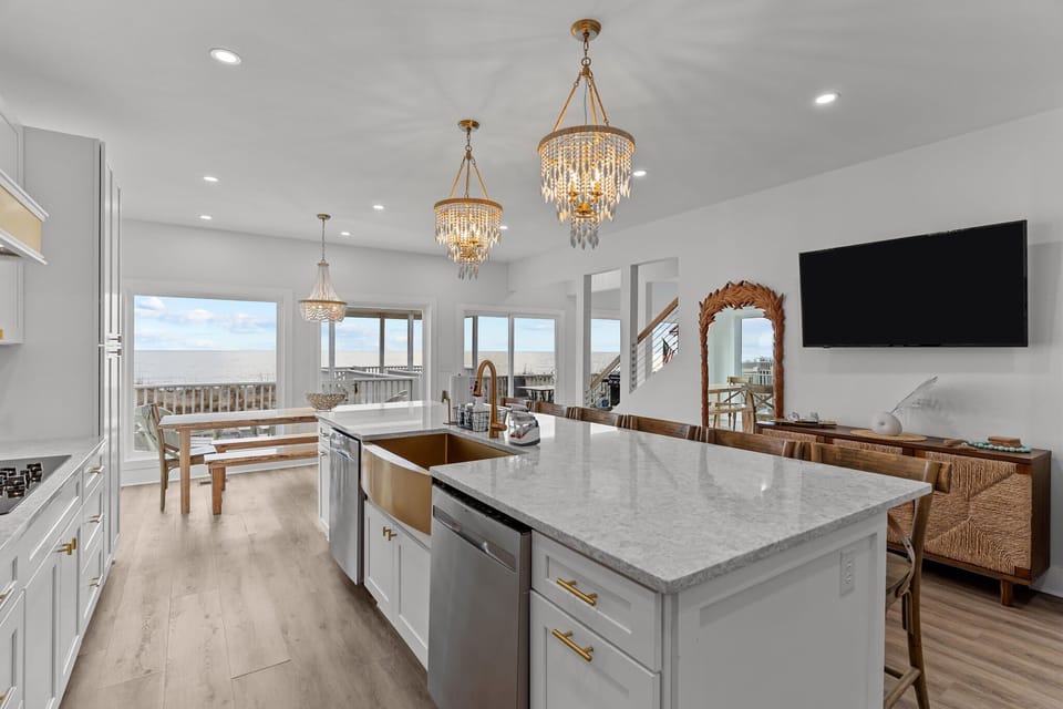 Fully equipped gourmet kitchen with breathtaking ocean views. Features include a refrigerator, dishwasher, stove/oven, microwave, blender, drip coffee maker and much more