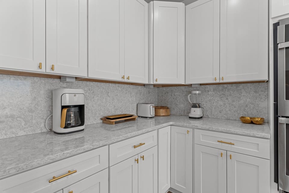 Fully equipped gourmet kitchen with breathtaking ocean views. Features include a refrigerator, dishwasher, stove/oven, microwave, blender, drip coffee maker and much more