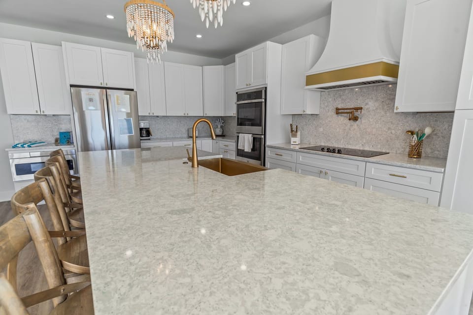 Fully equipped gourmet kitchen with breathtaking ocean views. Features include a refrigerator, dishwasher, stove/oven, microwave, blender, drip coffee maker and much more