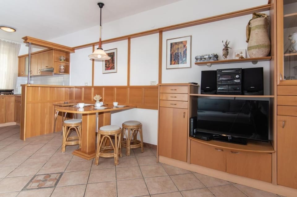 Family Apartment, 2 Bedrooms, Sea View, Beachside | Living area | Flat-screen TV