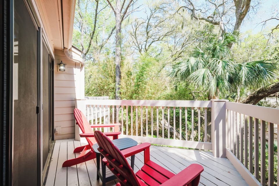 Your private balcony with seating overlooks the lagoon and pool.