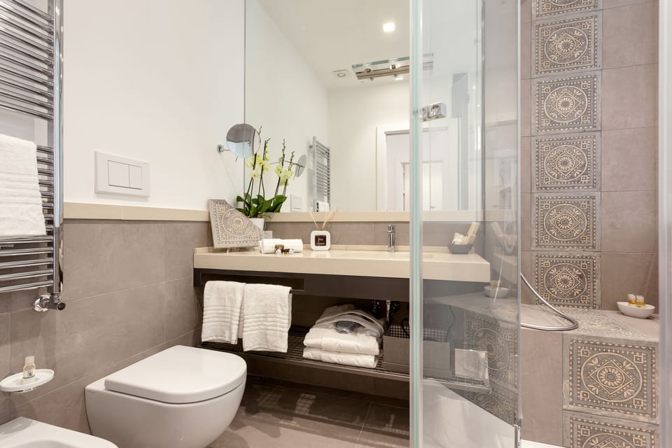 Rainfall showerhead, designer toiletries, hair dryer, bathrobes