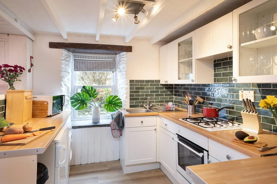 Kitchen, oven with gas hob, microwave, sink, window