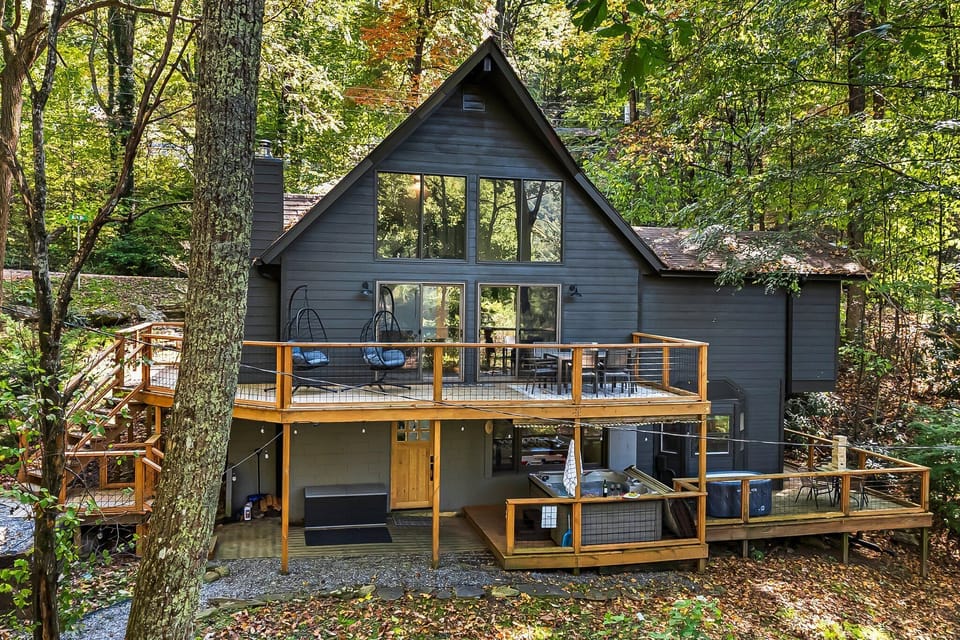 Double-decker deck with plenty of outdoor space with multiple seating areas