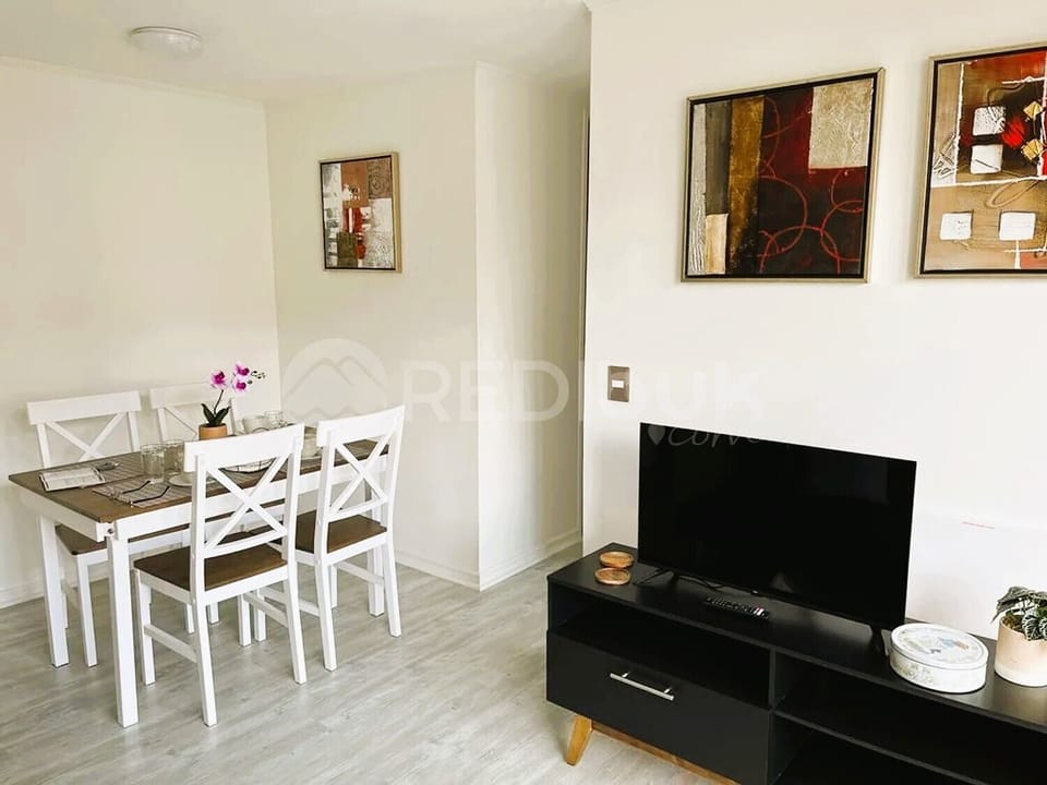 Comfort Apartment | Living area | 32-inch flat-screen TV with digital channels